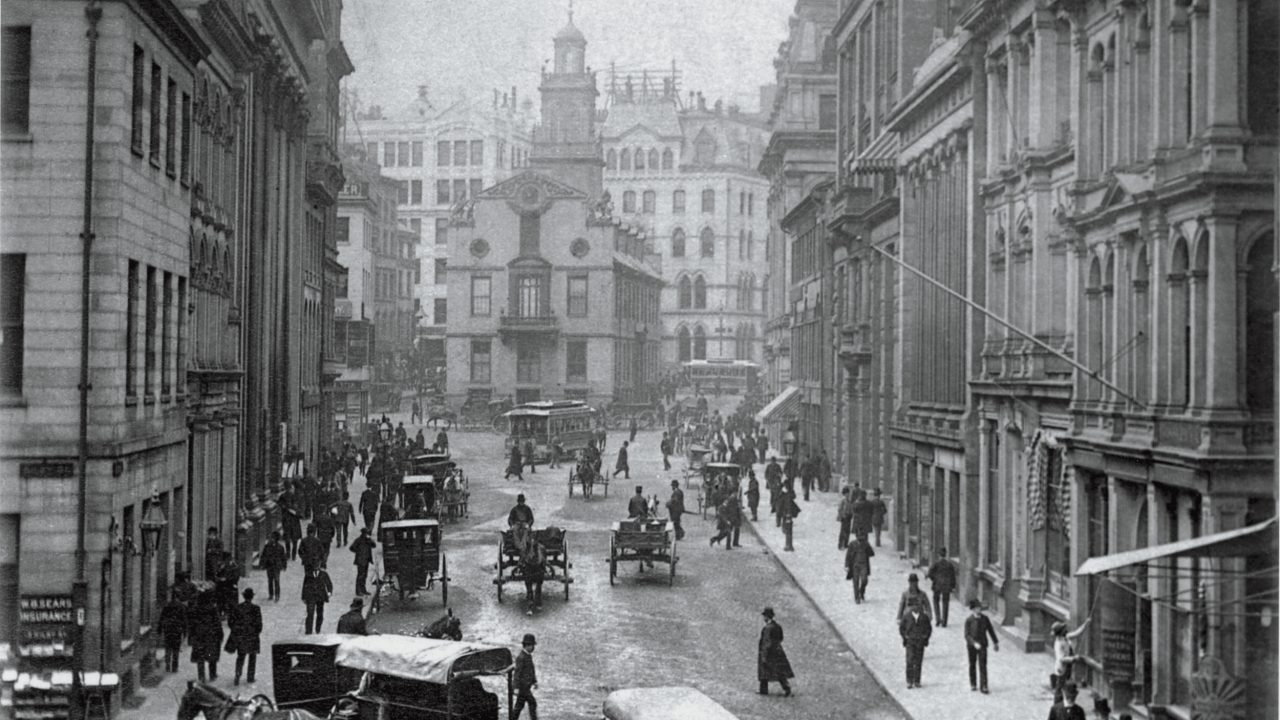 People moving along State Street in Boston, MA