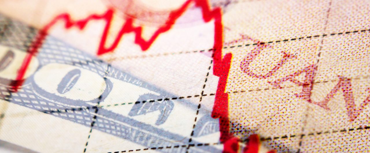 Yuan, Dollar, and Euro overlapping banknotes