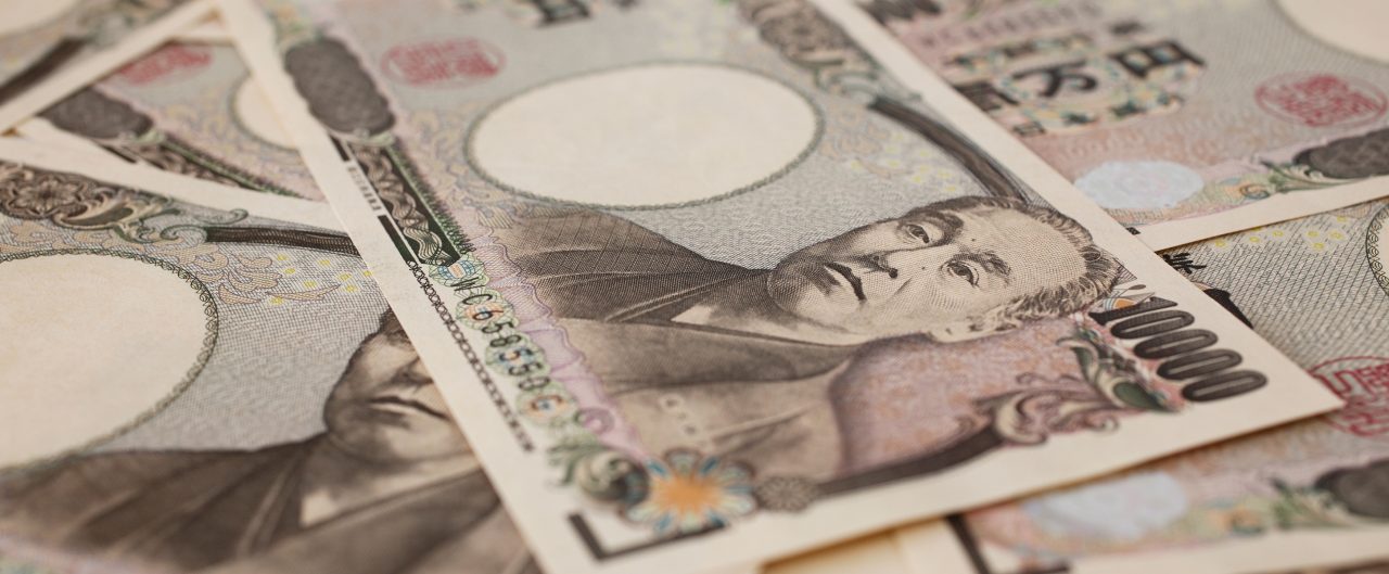 Japanese Yen bills scattered in a pile