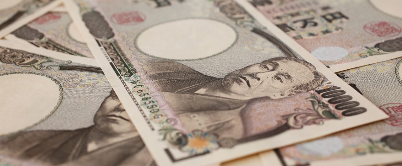 Japanese Yen bills scattered in a pile