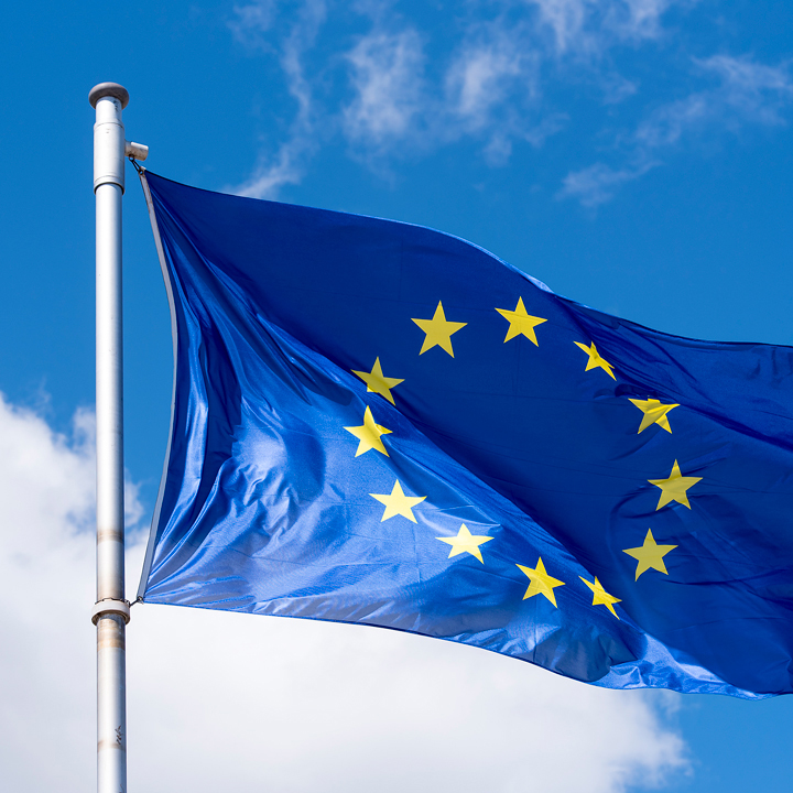 EU Flag waving against blue sky