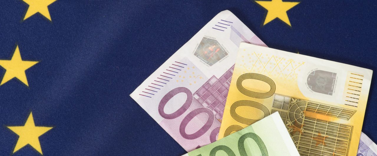 Euro bills placed on EU Flag
