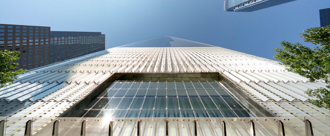 Upward View of One World Trade Center, NYC, with Blue Sky and Tops of Other Skyscrapers