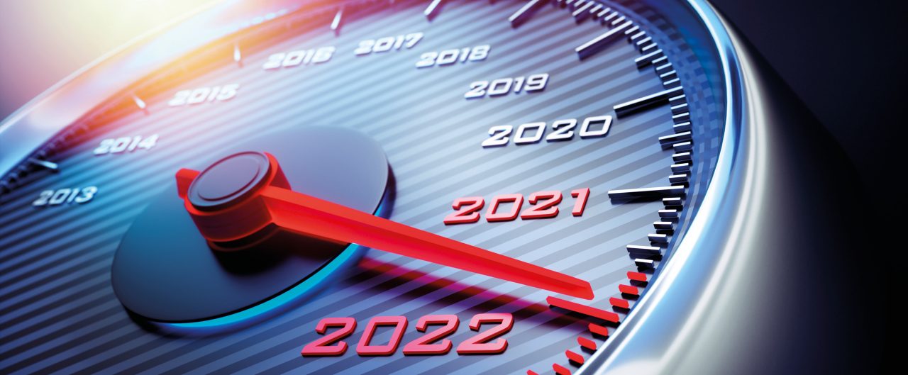 Dark stylish speedometer with needle moving to the year 2022