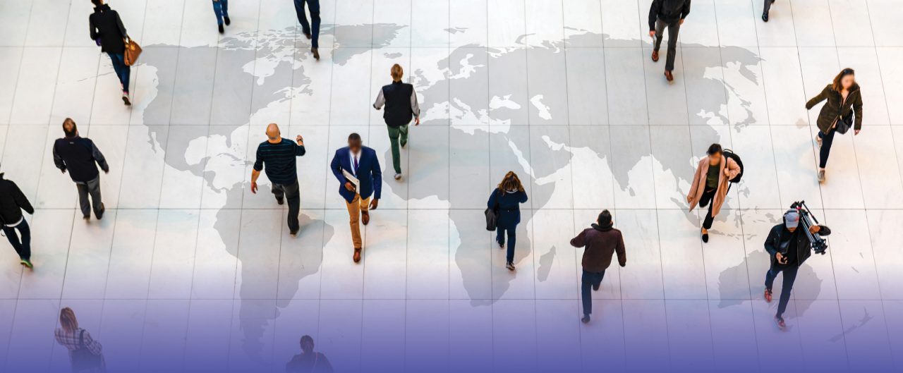 People walking over a world map
