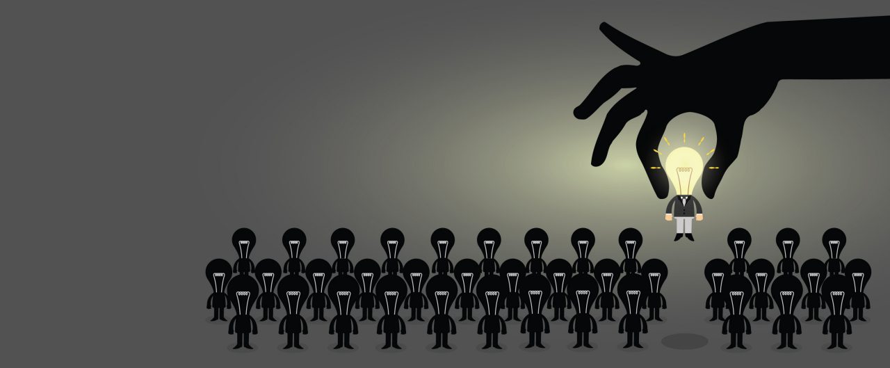 Hand picking Business man from a group of people, Human Resources concept to choose perfect candidate.