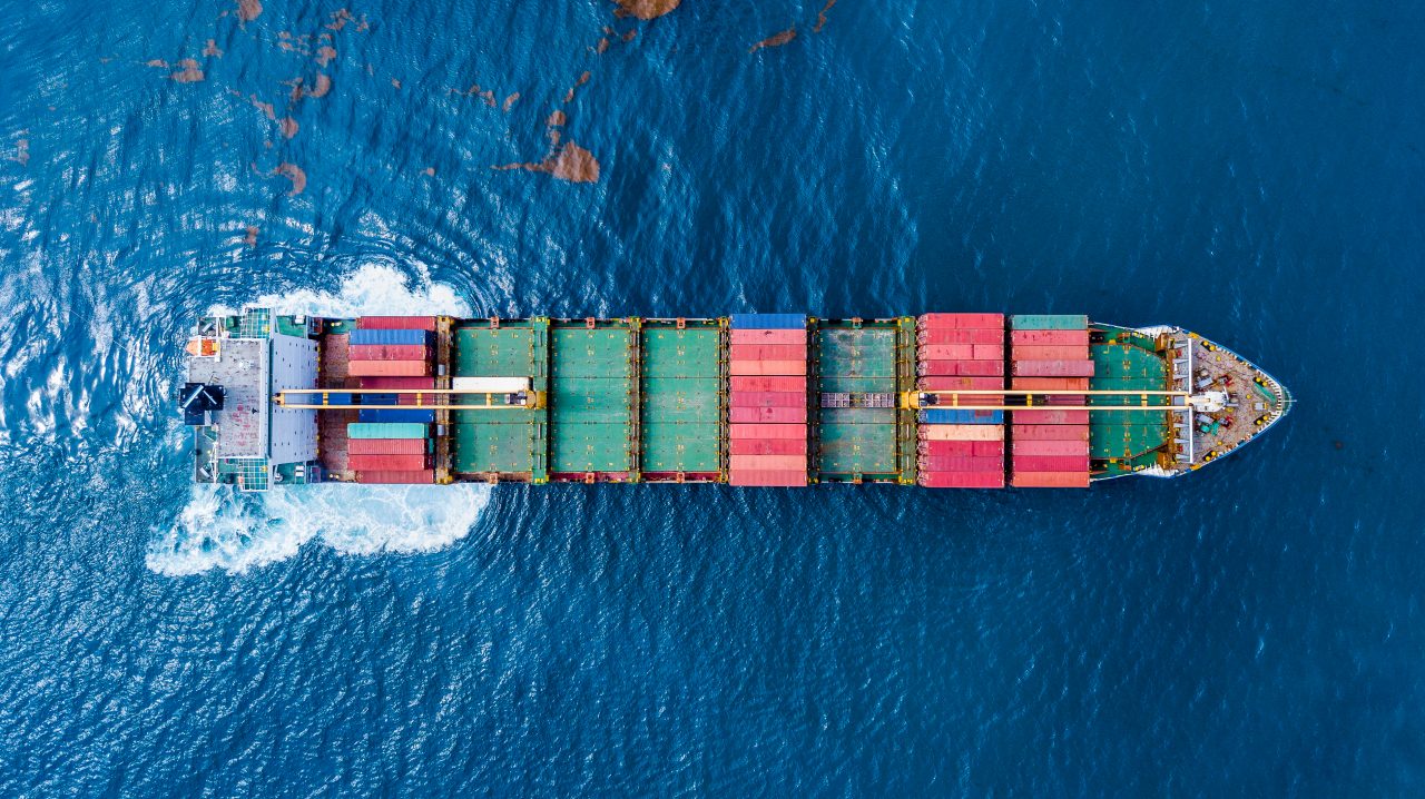  A cargo ship with many shipping containers on it in the ocean