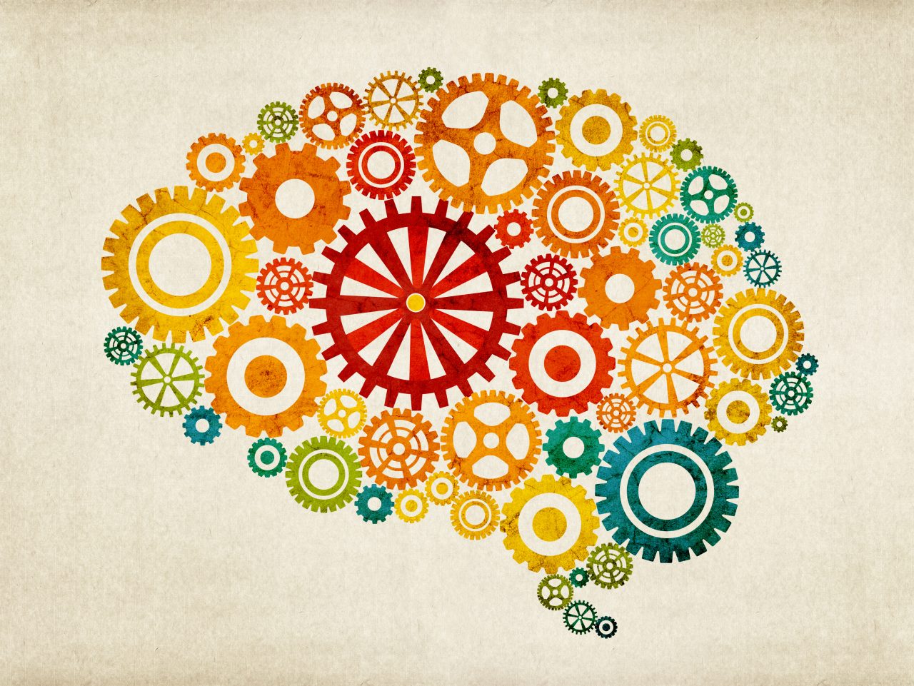 Colorful gears forming a human brain with beige background