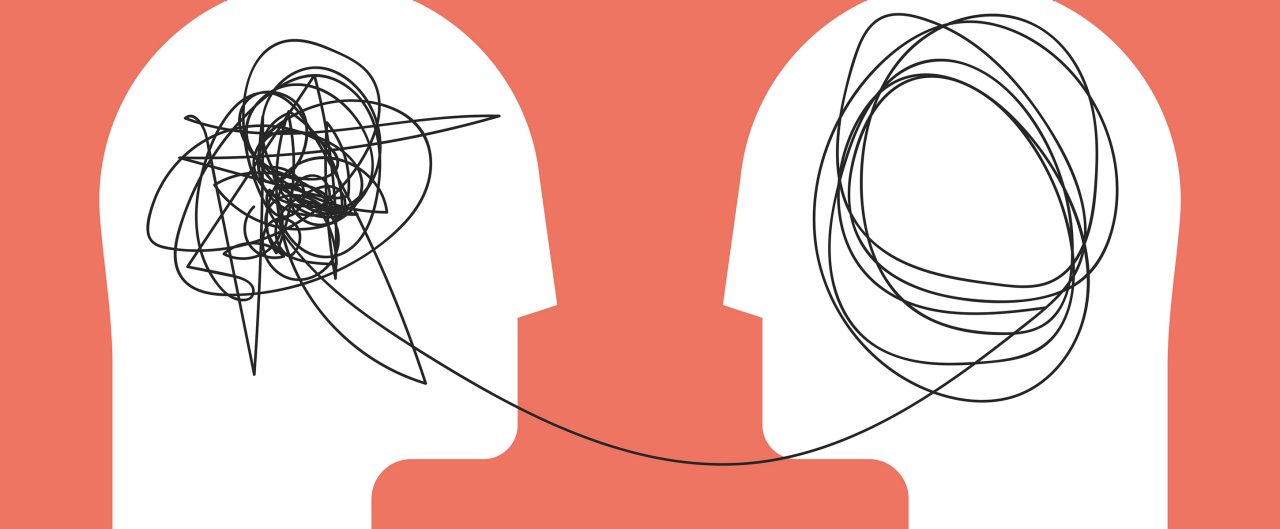 Two human heads connected by a string
