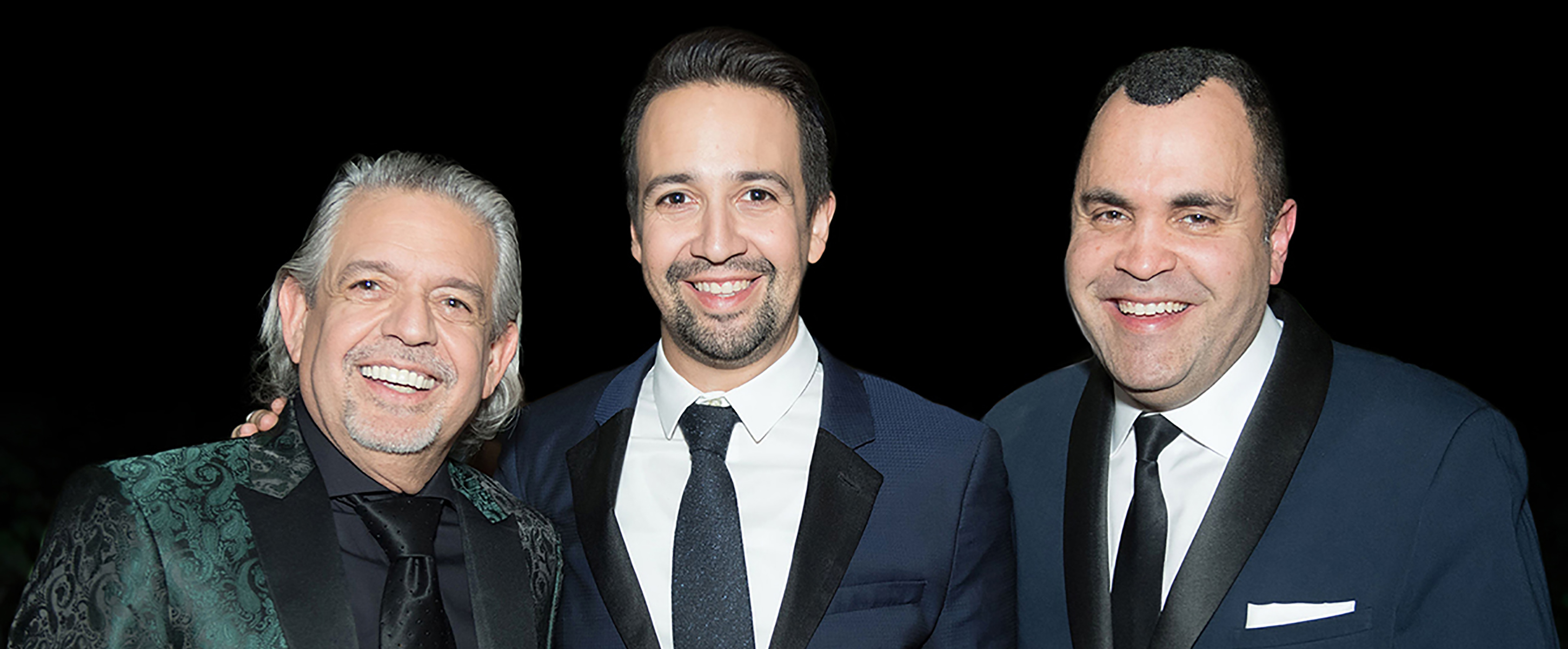 Lin-Manuel Miranda and two others standing together in tuxedos