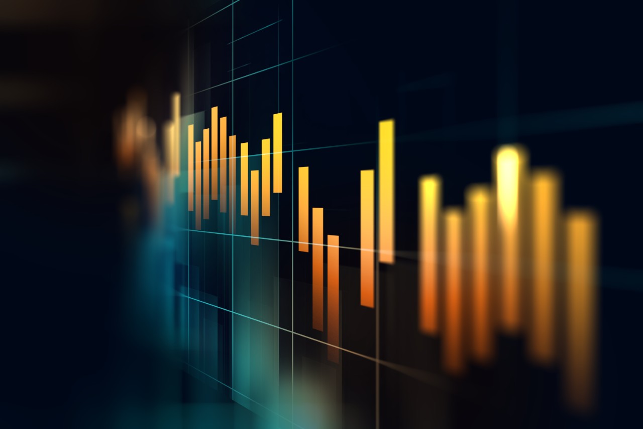 Financial stock market graph displayed in bright orange on a black background