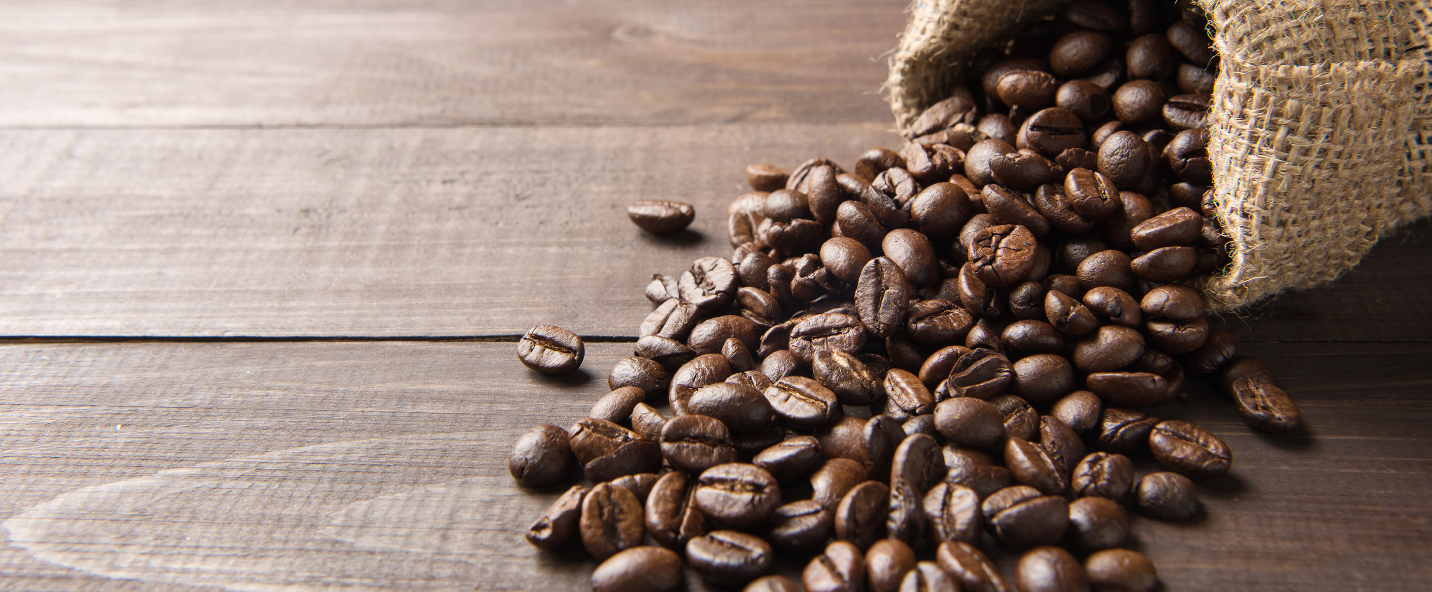 Coffee grains spilling out of bag